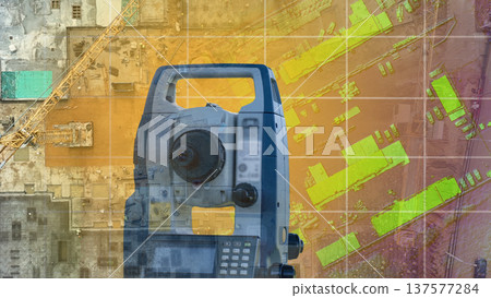 Modern surveyor's device on the background of the drawing. Surveying equipment construction 137577284