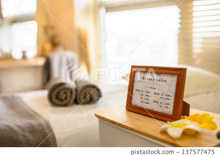 Price list and towels in a bright beauty salon 137577475
