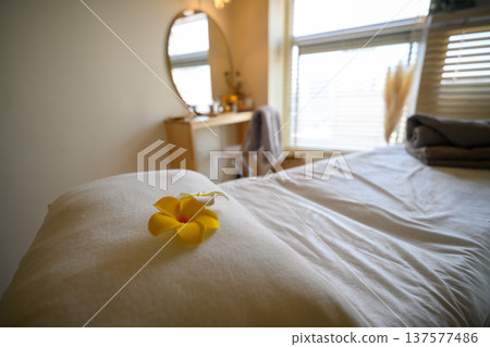 A treatment bed in a beauty salon with flowers 137577486