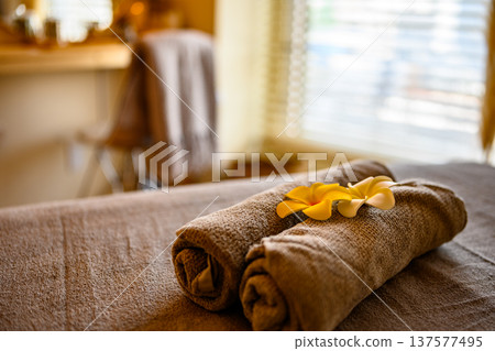 Towels and plumeria flowers 137577495