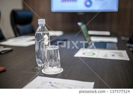 Water on the table in the conference room 137577524