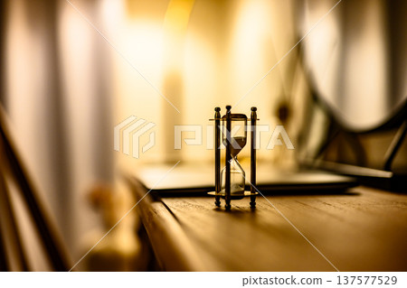 Hourglass and warm light 137577529