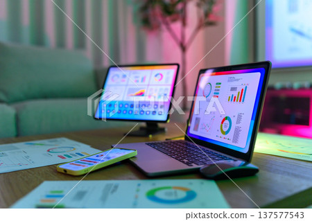 Equipment for data analysis at a desk at night 137577543