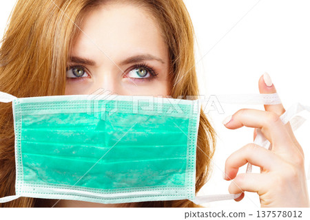 Female using protective face mask. Female using protective face mask. 137578012