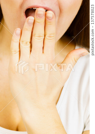 Young woman looking shocked 137578023