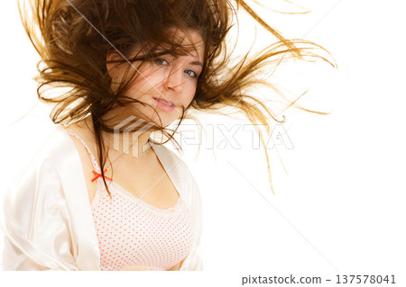 Brunette girl with blowing hair Brunette girl with blowing hair 137578041