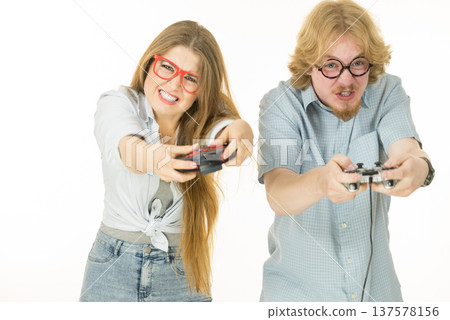Gaming couple playing games Gaming couple playing games 137578156