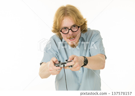 Gamer man holding gaming pad Gamer man holding gaming pad 137578157