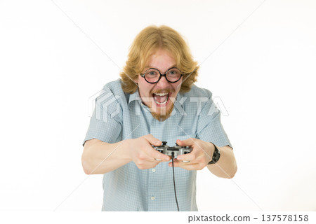 Gamer man holding gaming pad Gamer man holding gaming pad 137578158