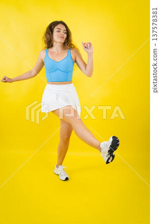 Young woman dancing happy celebrating success lifestyle 137578381