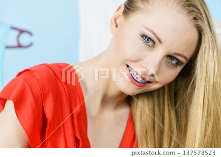 Woman in shop or wardrobe picking clothes Woman in shop or wardrobe picking clothes 137578523