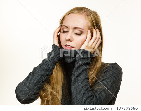 Sad girl in warm season clothing Sad girl in warm season clothing 137578560