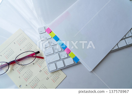 Calendar, keyboard and glasses on a table Calendar, keyboard and glasses on a table 137578967