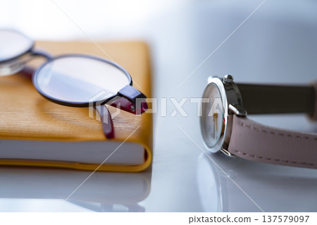 Notebook, glasses and watch on the table Notebook, glasses and watch on the table 137579097