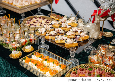 Catering buffet table with holiday appetizers and snacks 137579350