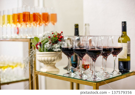 Red wine glasses and festive drinks ready for celebration 137579356
