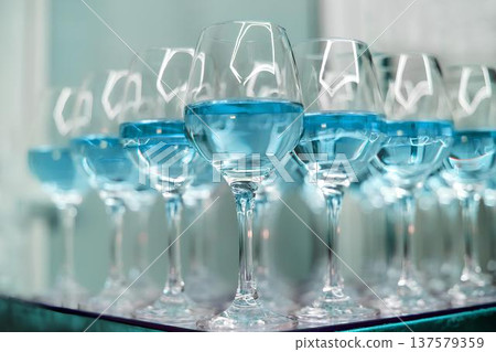 Row of blue liquid drinks ready for celebration 137579359