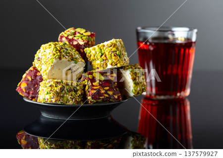 Turkish delights on a black reflective background. 137579927