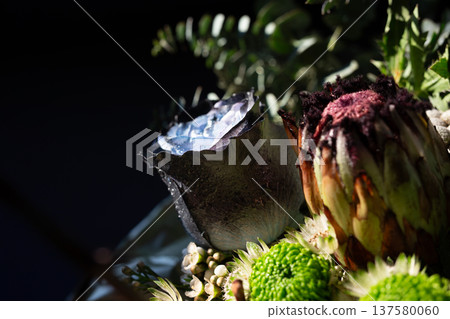 Title: Artistic floral bouquet with blue rose and protea on dark background Title: Artistic floral bouquet with blue rose and protea on dark background 137580060