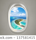 Aerial view of a tropical beach captured from an airplane porthole, showcasing a stunning perspective 137581415