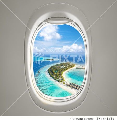 Aerial view of a tropical beach captured from an airplane porthole, showcasing a stunning perspective Aerial view of a tropical beach captured from an airplane porthole, showcasing a stunning perspective 137581415