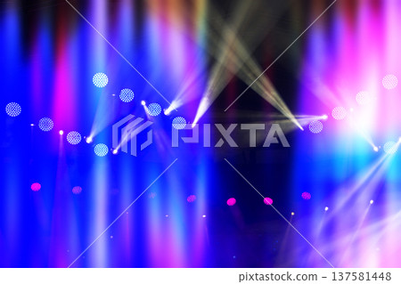 A stage with lights on it. The lights are blue, purple, and pink. There are many lights on the stage A stage with lights on it. The lights are blue, purple, and pink. There are many lights on the stage 137581448