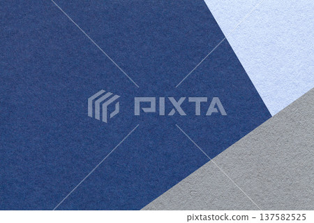 Dark blue textured paper background with light gray triangular corner and copy space. Template for presentation, banner 137582525