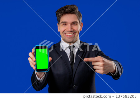 Surprised Businessman Smartphone with Green Screen. Mobile application mockup Surprised Businessman Smartphone with Green Screen. Mobile application mockup 137583203
