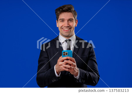 Mature businessman surfing internet on smartphone. Man using social networks 137583213