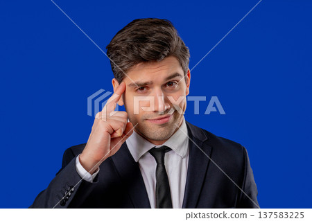 Smart Businessman With Gesture - You, Think About It. Looking Camera On blue Smart Businessman With Gesture - You, Think About It. Looking Camera On blue 137583225