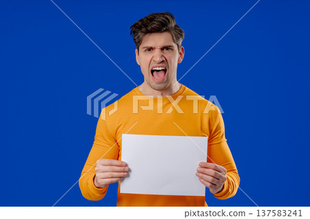 Angry Man Holding Blank A4 White Paper Poster and Shouting. Protest, complaint Angry Man Holding Blank A4 White Paper Poster and Shouting. Protest, complaint 137583241