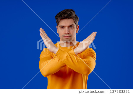 Dissatisfied handsome man Disapproving With No Sign, Refuse Offer. Rejecting 137583251