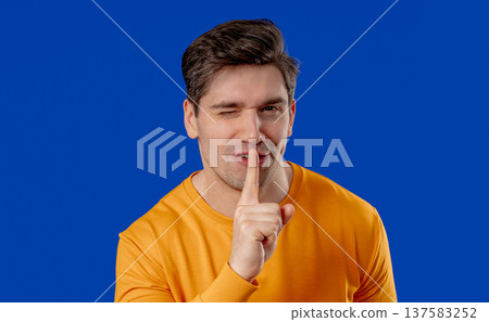 Handsome Man With Gesture Of Shhh, Secret, Silence, Conspiracy, Quiet, Rumors 137583252