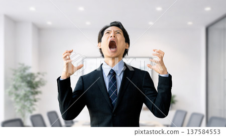 Male businessman screaming in anger and stress 137584553
