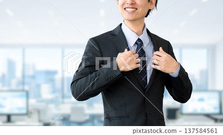 Motivated male businessman in a suit Motivated male businessman in a suit 137584561
