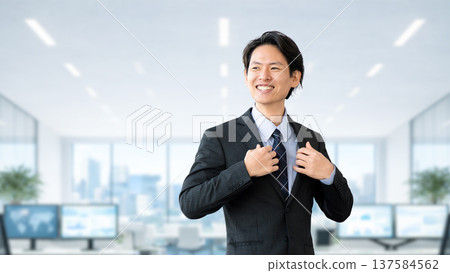 Motivated male businessman in a suit Motivated male businessman in a suit 137584562
