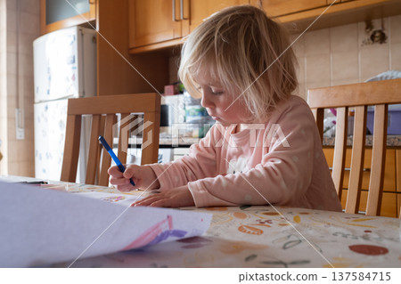 Little 4 Year Old Girl Learning to Write Letters in the Kitchen Little 4 Year Old Girl Learning to Write Letters in the Kitchen 137584715