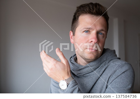a distressed middle aged man feeling overwhelmed and stuck in a difficult situation a distressed middle aged man feeling overwhelmed and stuck in a difficult situation 137584736