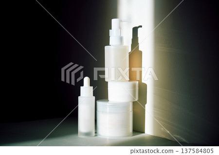 Skincare bottles and jars displaying minimalist beauty products 137584805