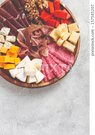 assortment of cheese meat cuts, on a plate, top view, no people, 137585207