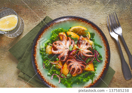 Warm salad, grilled mini octopus, with potatoes and fresh herbs, homemade,no people 137585238