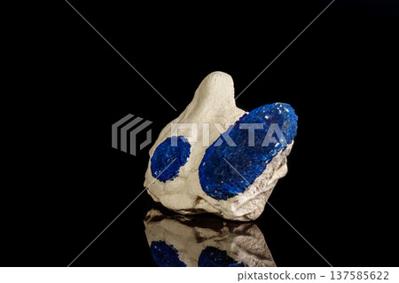 Macro mineral stone Azurite in siltstone against black background 137585622