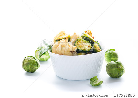 Warm salad with Brussels sprouts on a white background Warm salad with Brussels sprouts on a white background 137585899