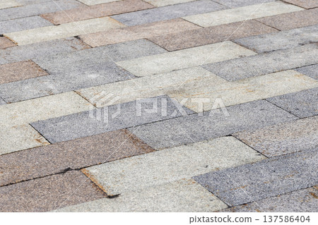 Street pavement made of granite tiles Street pavement made of granite tiles 137586404