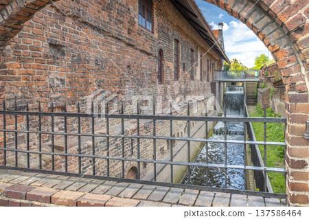 The Great Mill in Gdansk, a city on the Baltic coast of northern Poland, Europe. Brick architecture and water features combine for a scenic old-world view. The Great Mill in Gdansk, a city on the Baltic coast of northern Poland, Europe. Brick architecture and water features combine for a scenic old-world view. 137586464
