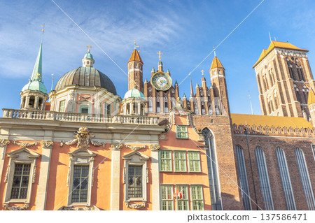 St. Mary's Church in Gdansk, a city on the Baltic coast of northern Poland, Europe. Cityscape of old town Gdansk Poland, featuring historic architecture, domes, towers, and a clock tower. 137586471