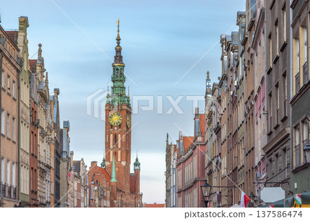 Gdansk, a city on Baltic coast of northern Poland, Europe. Historical European city street view, featuring a central clock tower and intricate architecture, conveying cultural richness and heritage. 137586474
