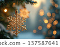 Golden snowflake ornament hanging on christmas tree branch 137587641