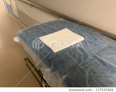 Hospital gurney with clean sheets in hallway Hospital gurney with clean sheets in hallway 137587688