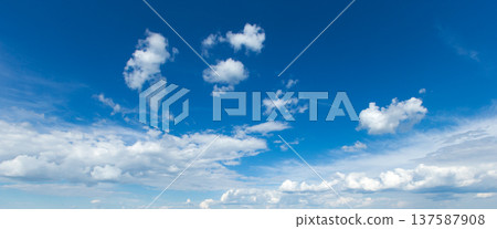blue sky background with tiny clouds 137587908